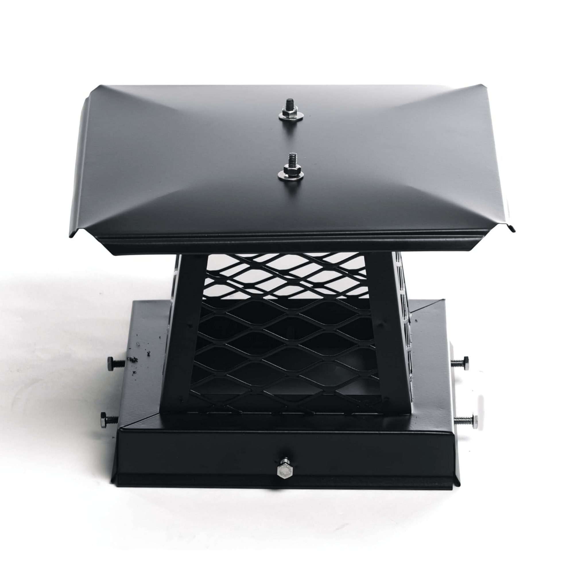 Close-up of a black powder-coated chimney cap with mesh sides, providing protection against rain, wind, and debris.